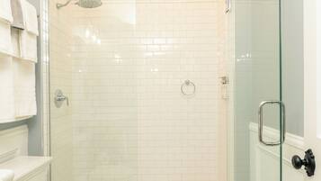 Deluxe Single Room, 1 King Bed | Bathroom | Shower, rainfall showerhead, designer toiletries, hair dryer