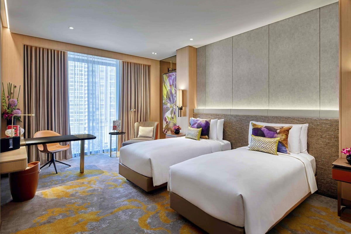 Premium bedding, down comforters, minibar, in-room safe