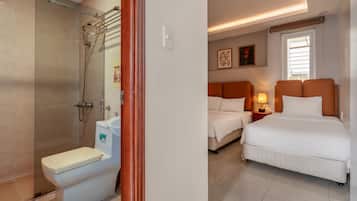 Family Quadruple Room | Living area | Flat-screen TV