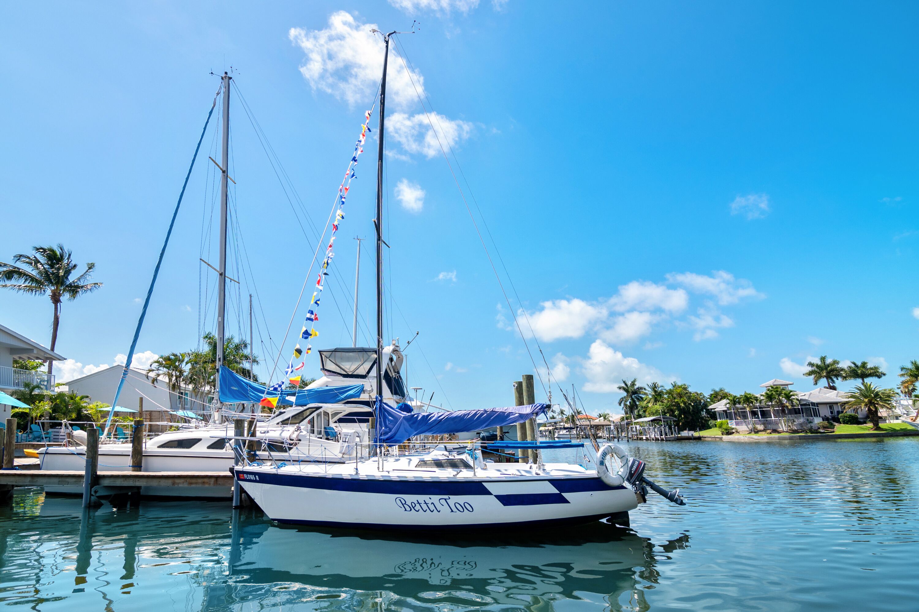 A marina with a sailboat named "Betty Too" docked.