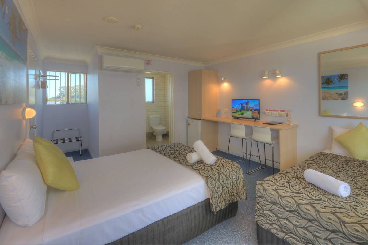 Premium bedding, desk, laptop workspace, WiFi (free)