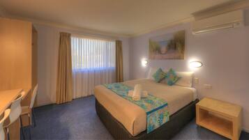 Premium bedding, desk, laptop workspace, free WiFi