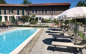 Seasonal outdoor pool, pool umbrellas, pool loungers