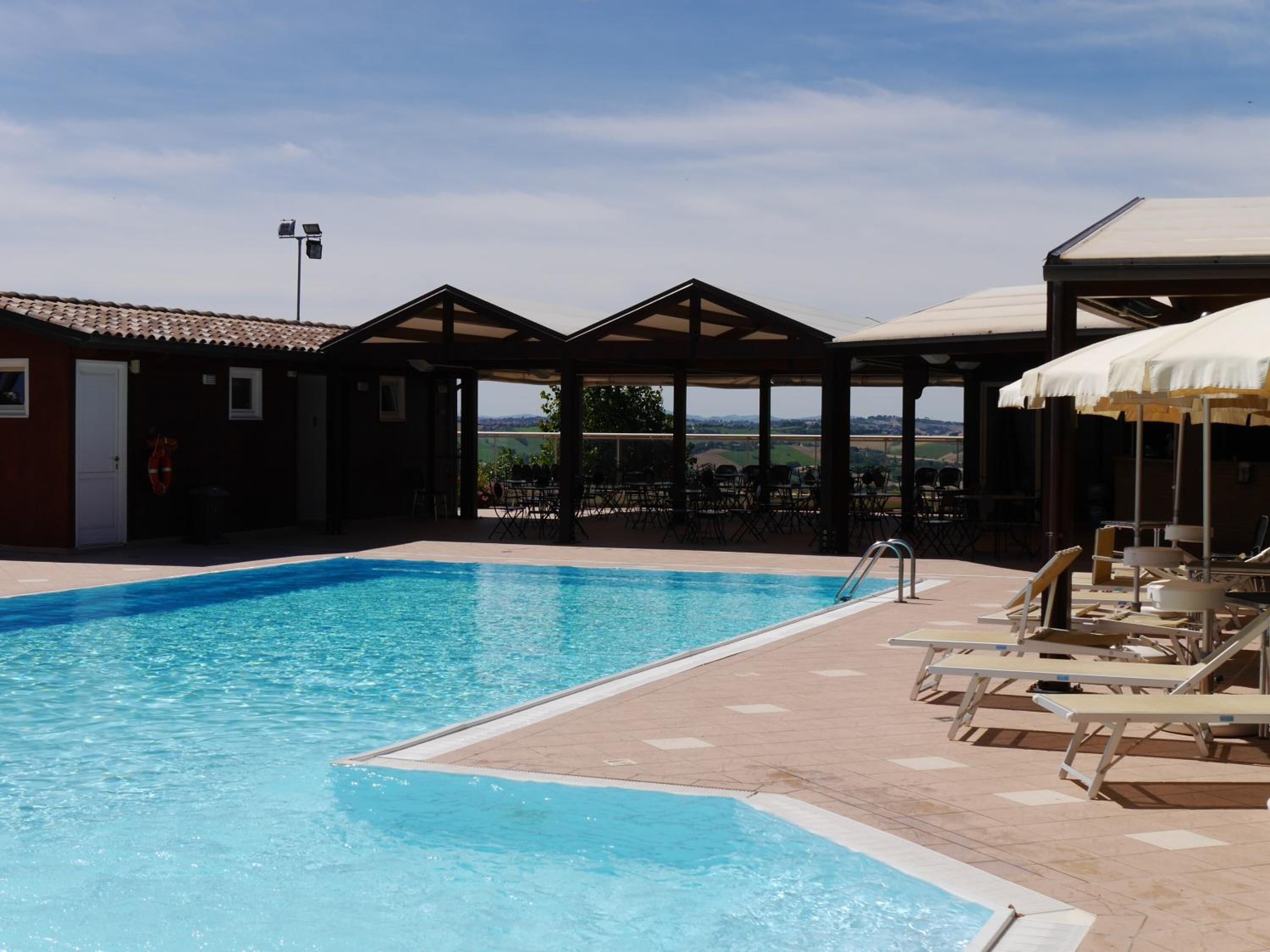 outdoor pool, pool umbrellas, pool loungers