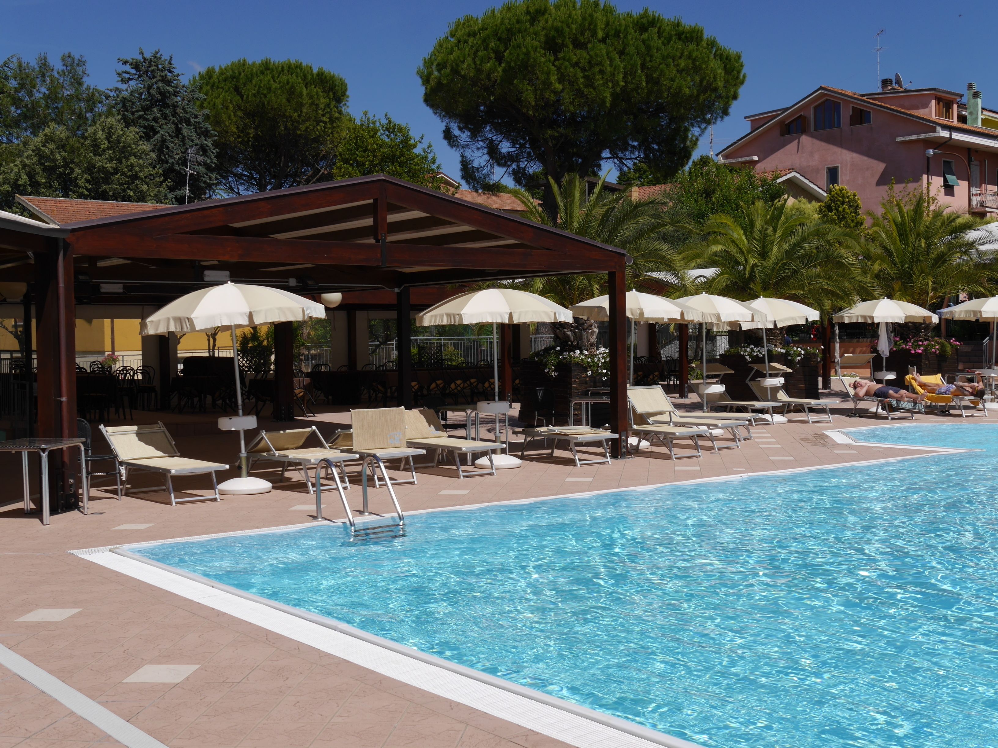 outdoor pool, pool umbrellas, pool loungers