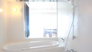 Deluxe Room with 2 Double Beds | Bathroom | Shower, free toiletries, hair dryer, slippers