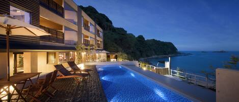 Outdoor pool, open 6:00 AM to 11:30 PM, pool umbrellas