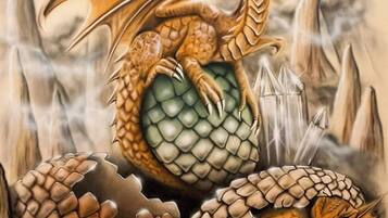 A dragon perched atop a large, round, green object surrounded by rocky terrain.