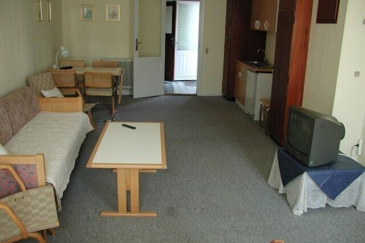 Family Room, Private Bathroom | Living area | TV