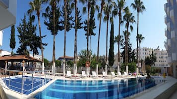 Outdoor pool, pool umbrellas, sun loungers