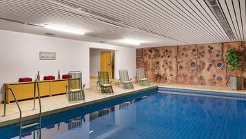 Relax by the pool with lounge chairs and a refreshing view.