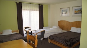 Deluxe Quadruple Room | Desk, iron/ironing board, free cots/infant beds, free WiFi