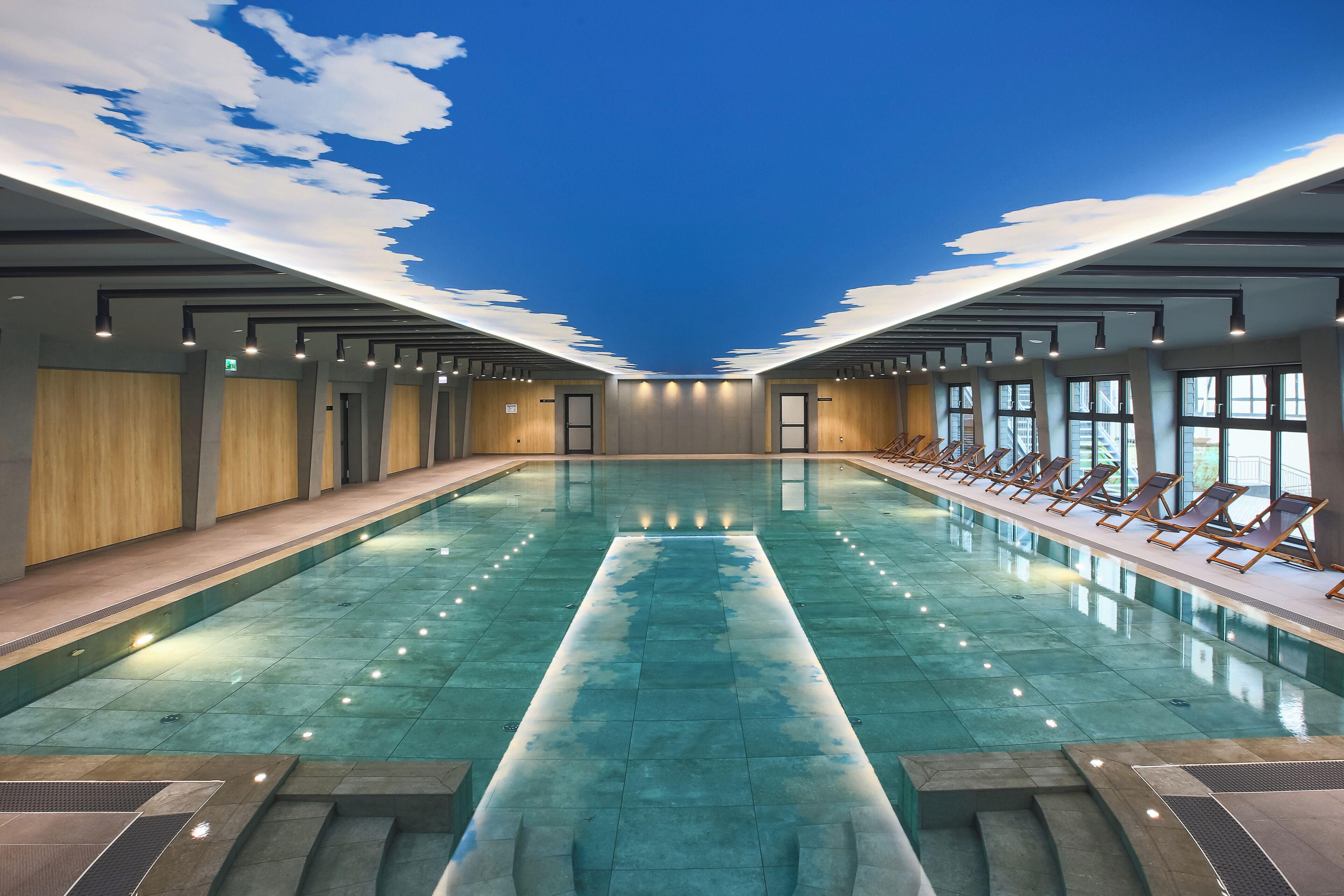 Indoor pool, open 7:00 AM to 9:00 PM, pool loungers