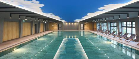 Indoor pool, open 7:00 AM to 9:00 PM, pool loungers