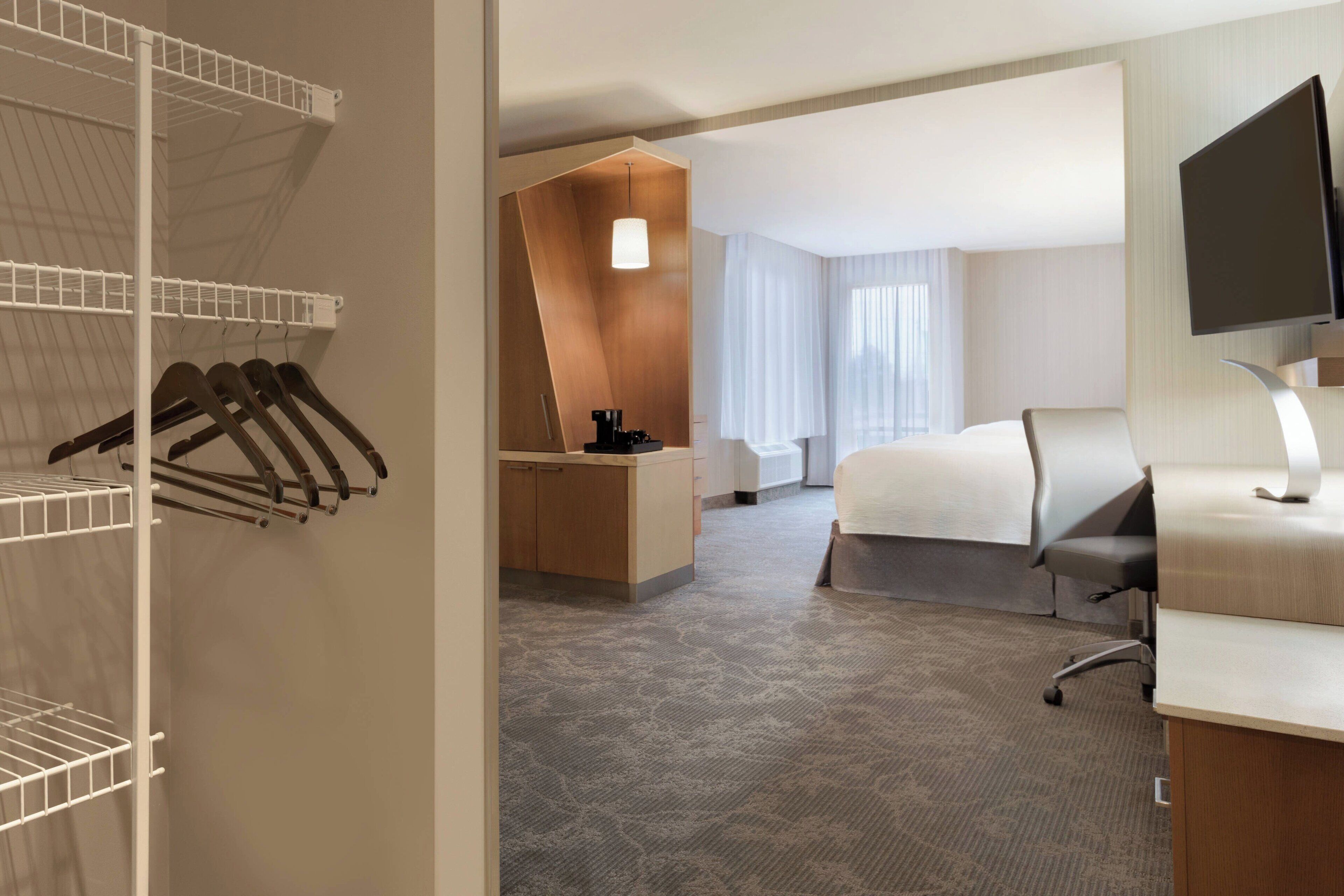 premium bedding, desk, laptop workspace, blackout curtains