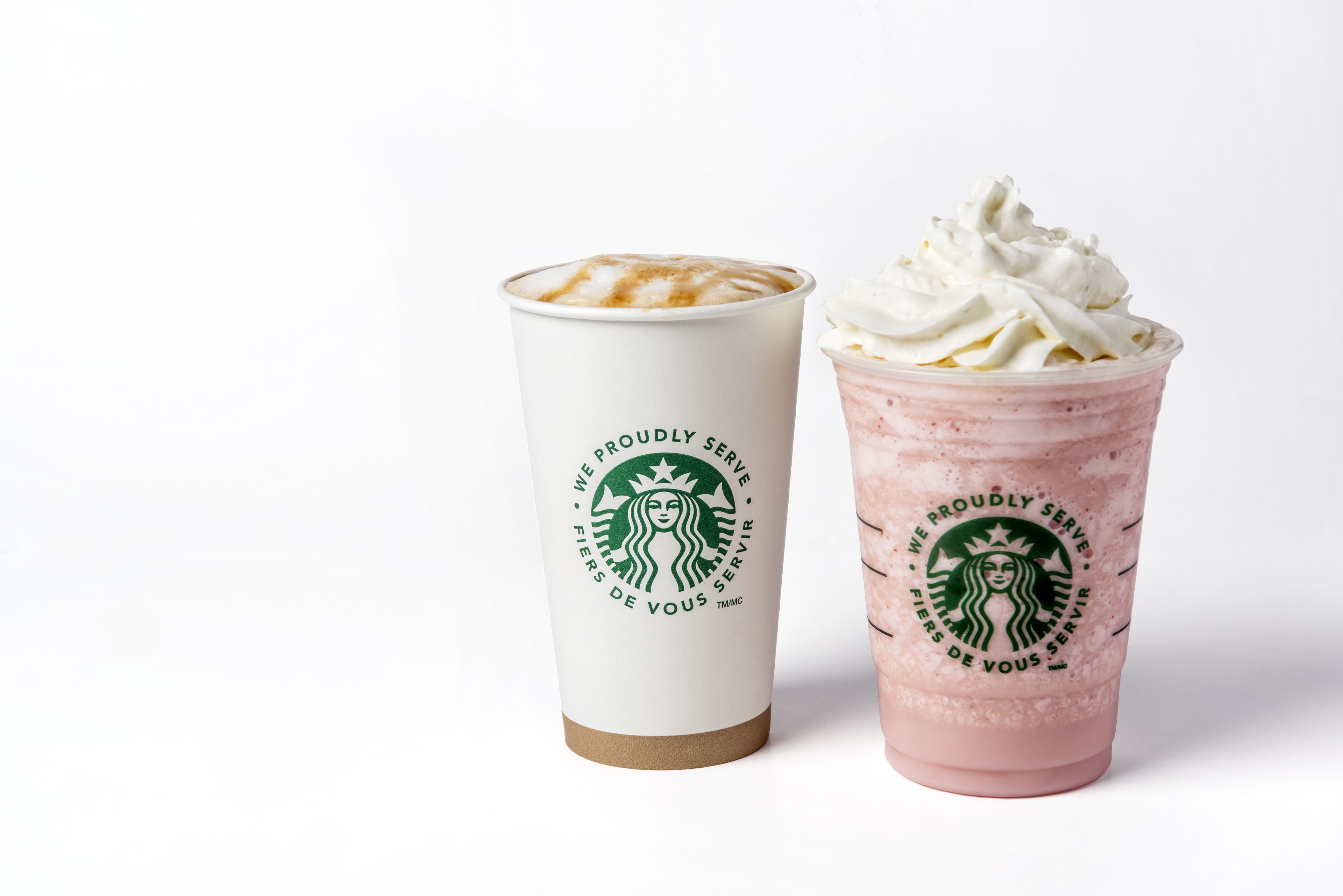 Two Starbucks cups, one with a latte and the other with a frappuccino.