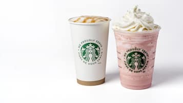 Two Starbucks cups, one with a latte and the other with a frappuccino.