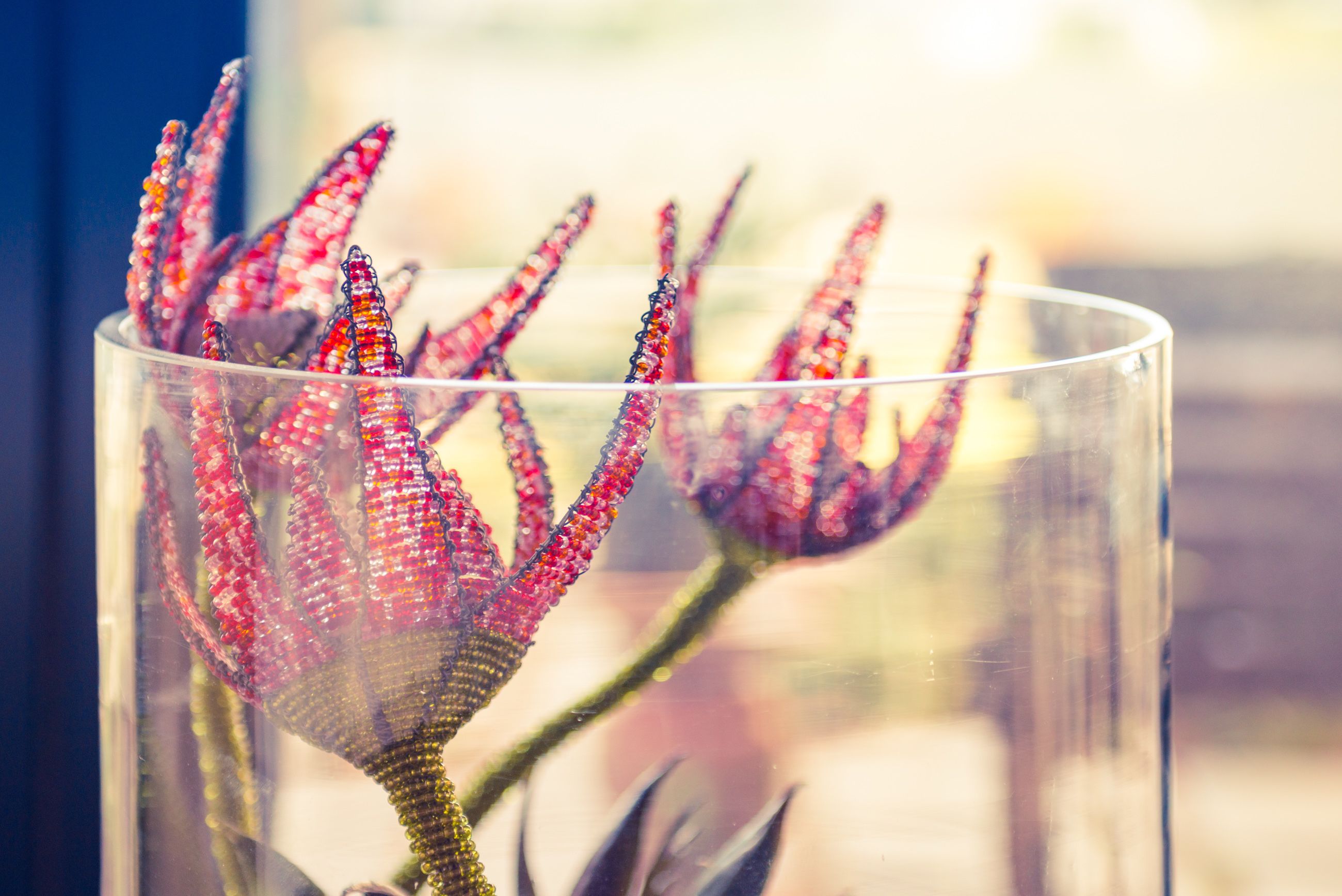 A clear glass vase with a decorative item inside.
