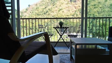 Apartment 1 Bedroom with Mountain View | Living area | Flat-screen TV