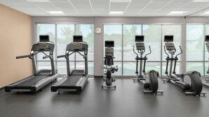 A gym with treadmills, elliptical machines, and stationary bikes. - Fairfield Inn & Suites by Marriott Atlanta Acworth (Acworth)