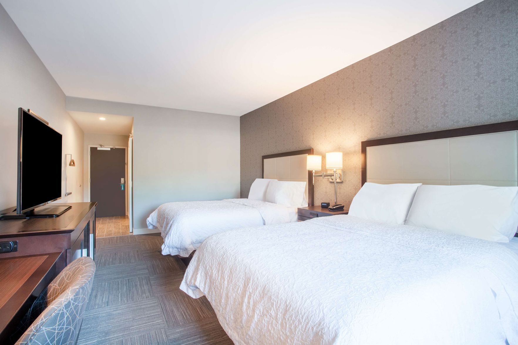 Premium bedding, down comforters, pillowtop beds, in-room safe
