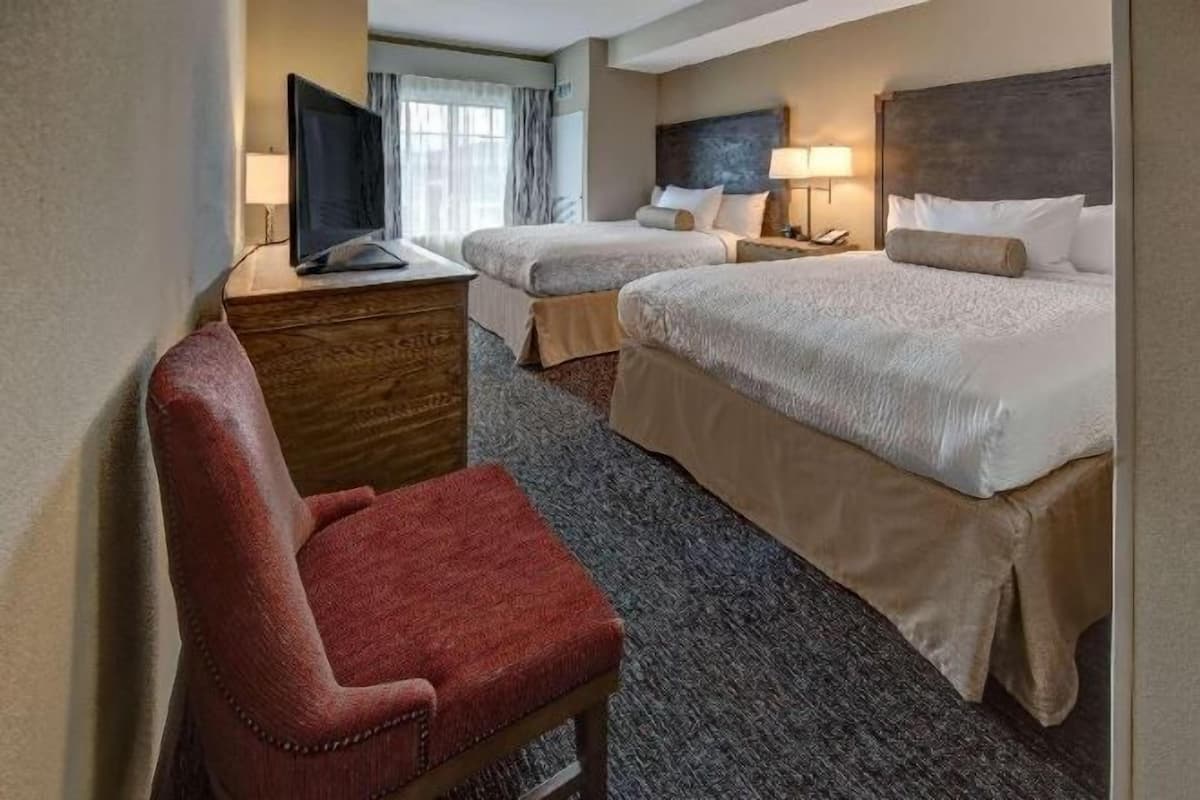 Premium bedding, blackout drapes, iron/ironing board