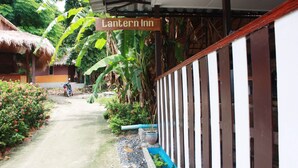 A pathway leading to a building with a sign reading "Lantern Inn." - Lantern Inn Koh Lipe (Koh Lipe)