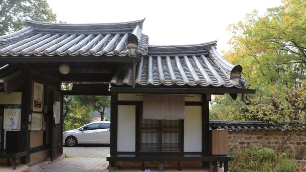 A traditional Korean pavilion with a tiled roof and wooden structure. - Chiam Gotaek (Andong)