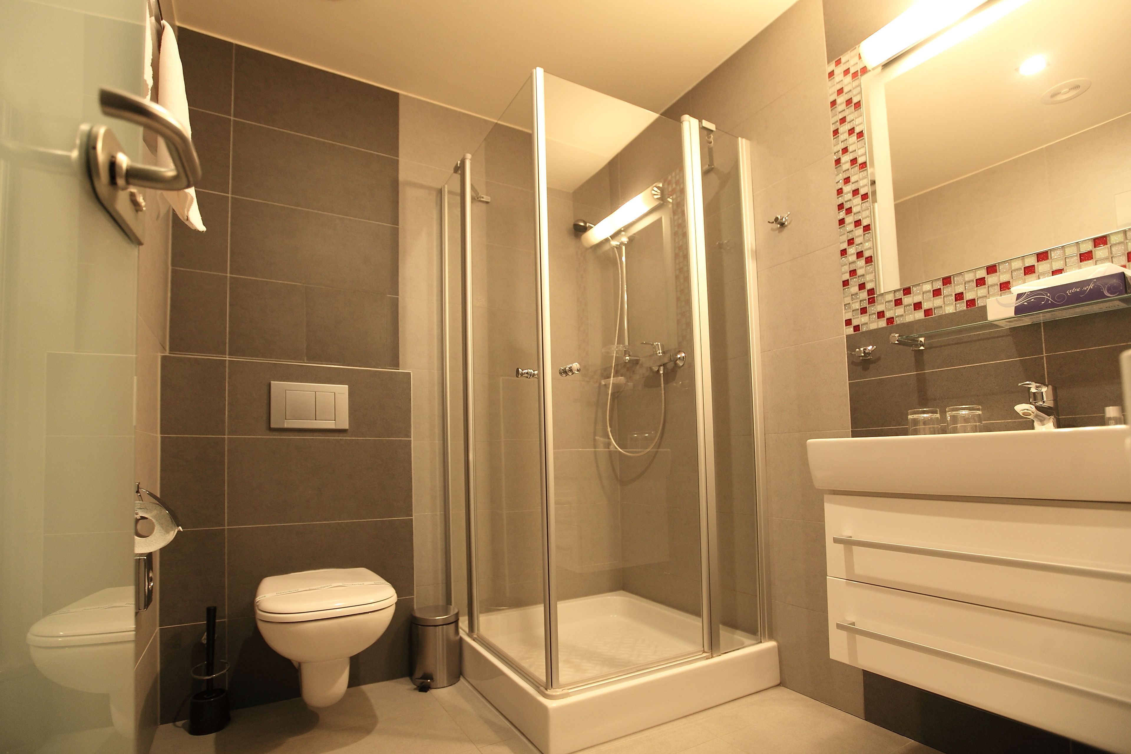 shower, free toiletries, bathrobes, slippers