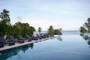 Outdoor pool, open 6:00 AM to 7:00 PM, free cabanas, pool umbrellas