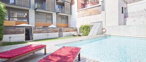 Outdoor pool, open 10:00 AM to 8:00 PM, pool umbrellas