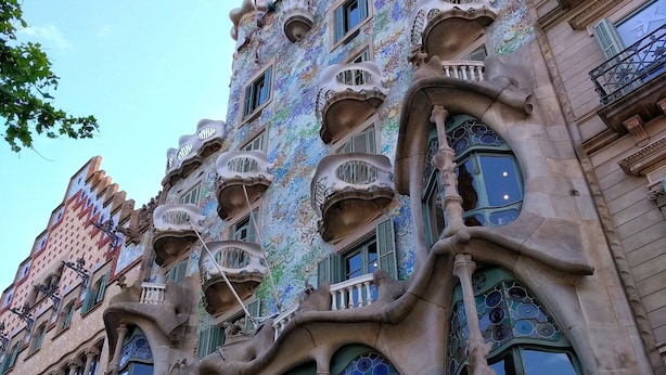A building with unique architectural features, including organic shapes and decorative elements. - MSB Pool with Terrace (Barcelona)
