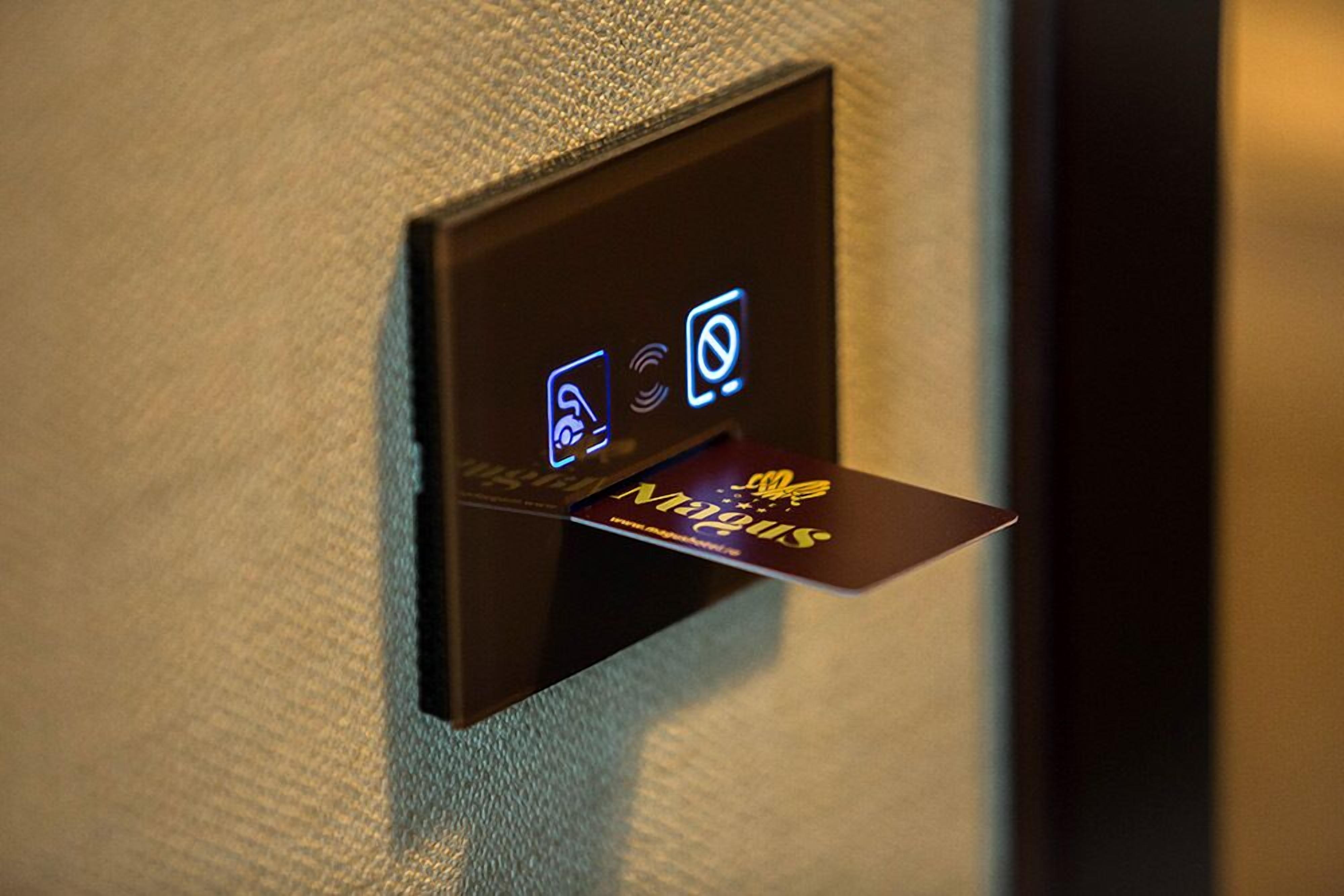 A card reader with a card inserted, displaying a logo and text.