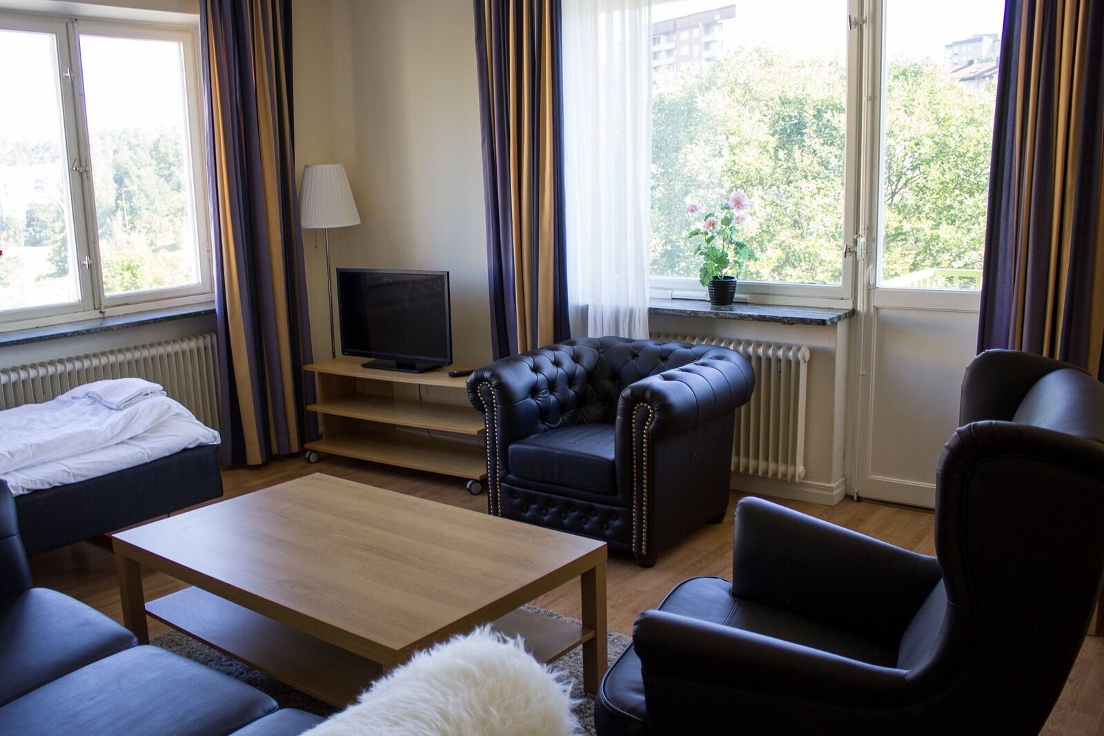 Family Apartment, 1 Bedroom, Kitchen | Living area | Flat-screen TV