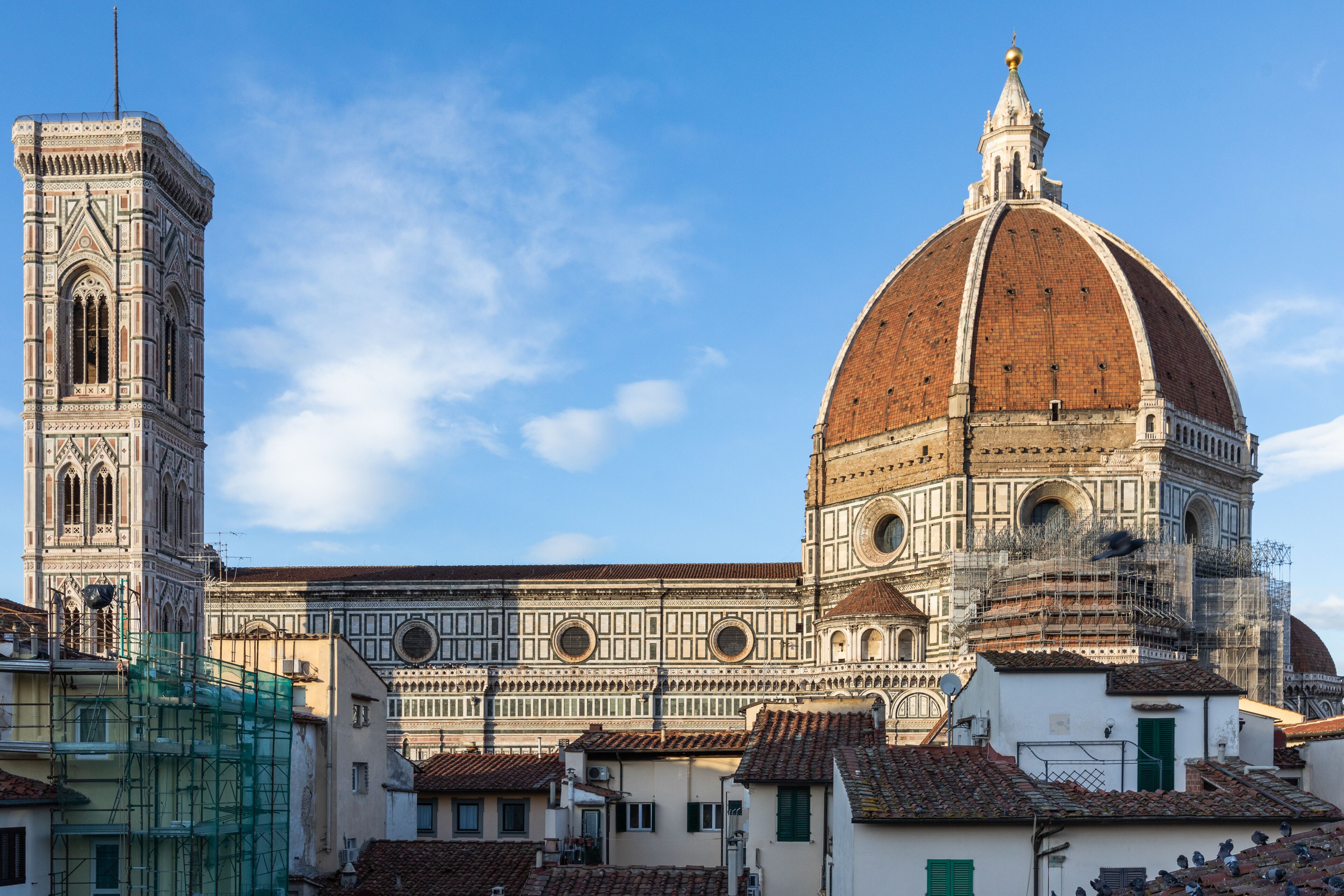 A historic building with a prominent dome and a tall tower.