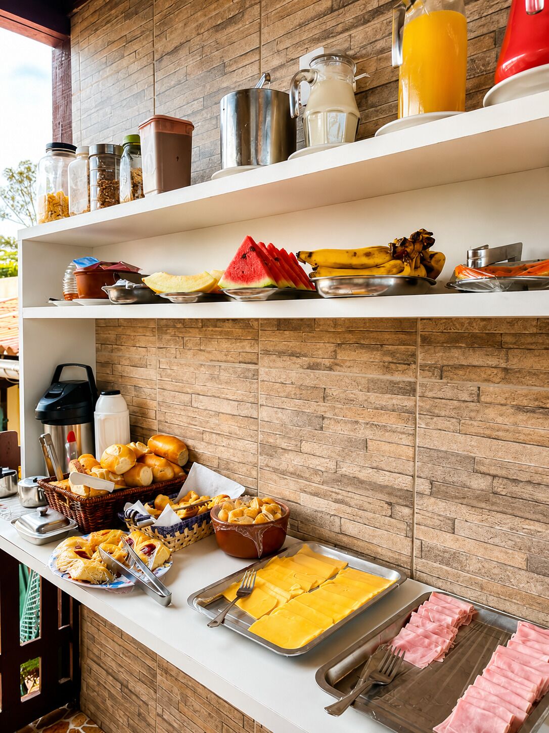 A buffet setup with various food items and condiments on shelves.