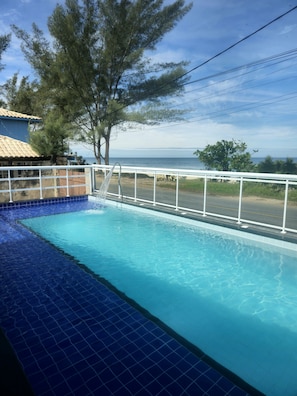 Outdoor pool, pool umbrellas, pool loungers