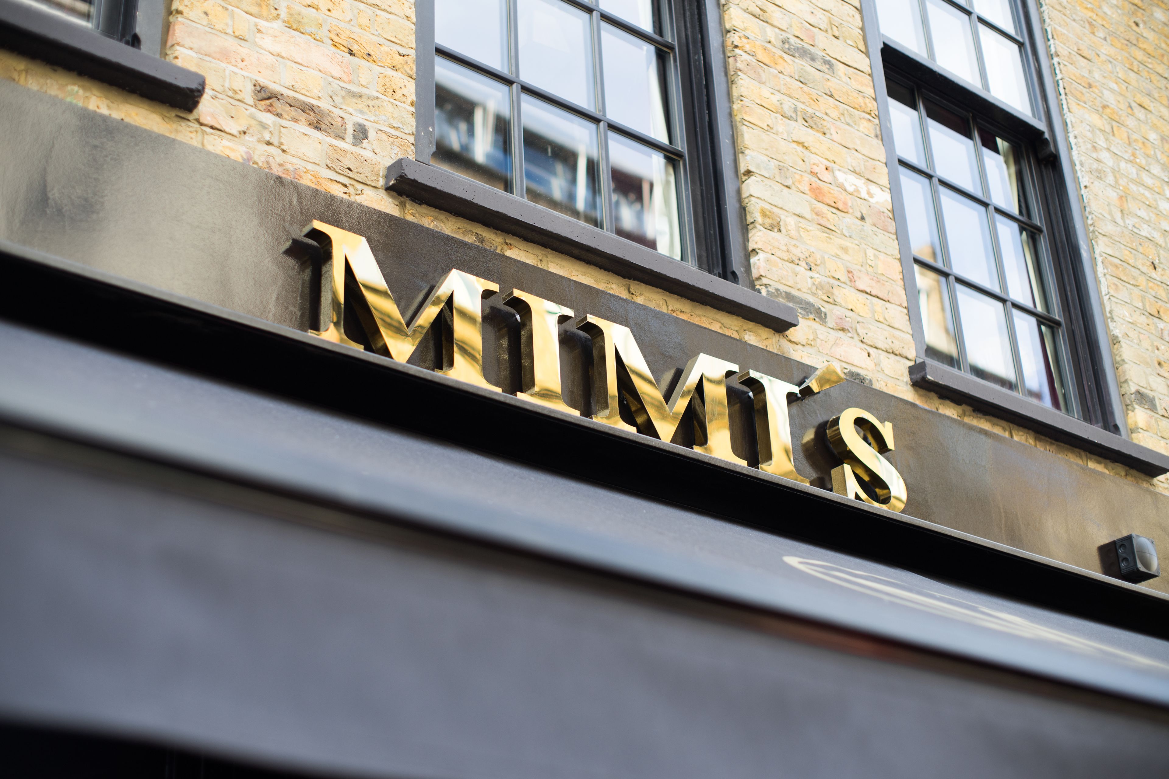 A building with a sign that reads "MIMIS".