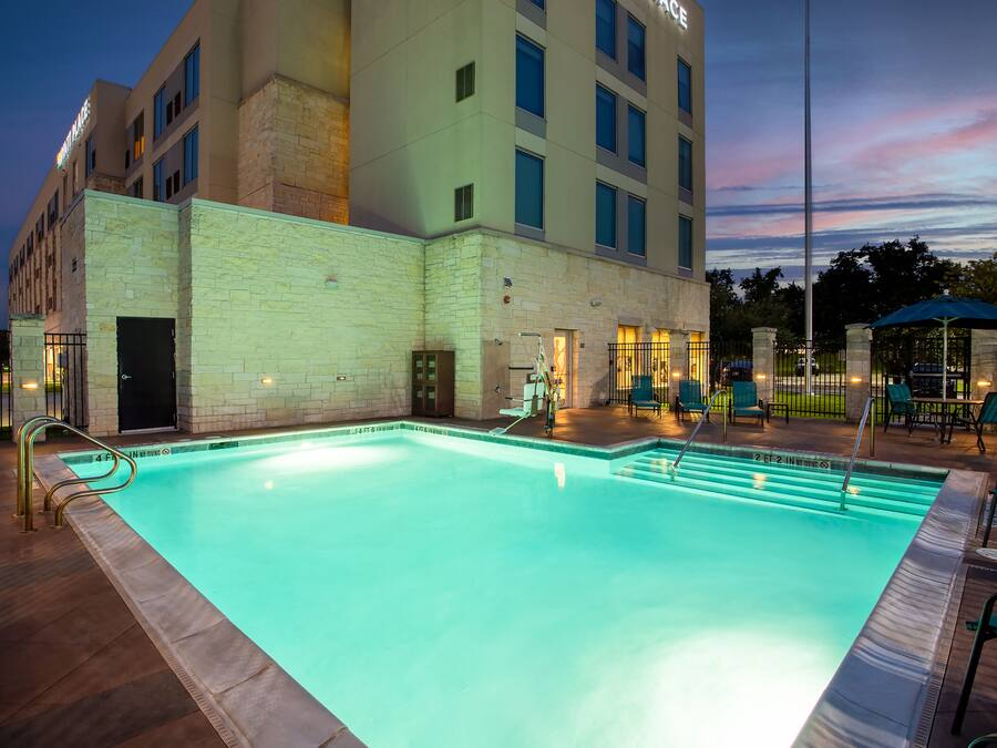 Outdoor pool, open 6 AM to 10 PM, sun loungers