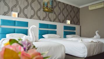 Superior Triple Room | Minibar, in-room safe, individually decorated, individually furnished