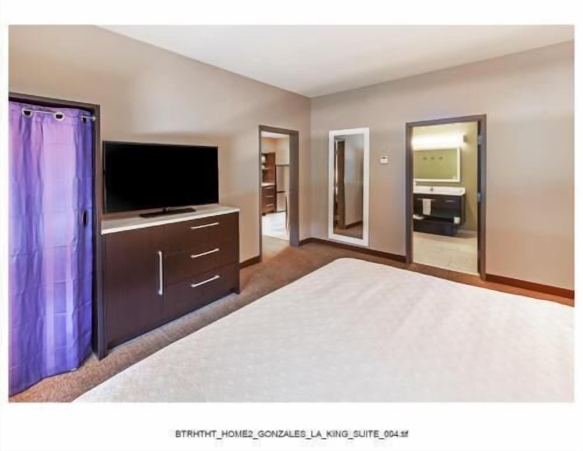 Hypo-allergenic bedding, desk, laptop workspace, blackout curtains