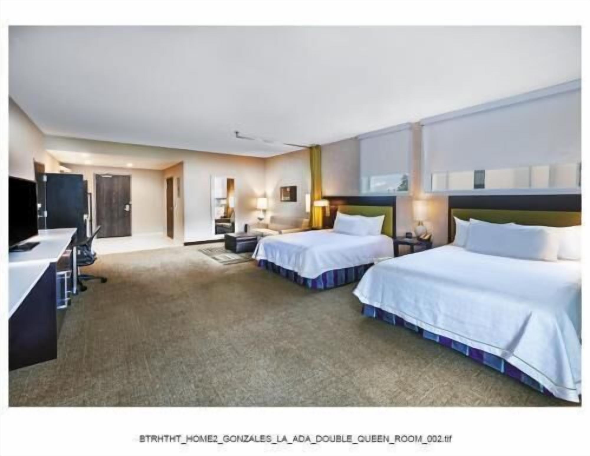 Hypo-allergenic bedding, desk, laptop workspace, blackout curtains