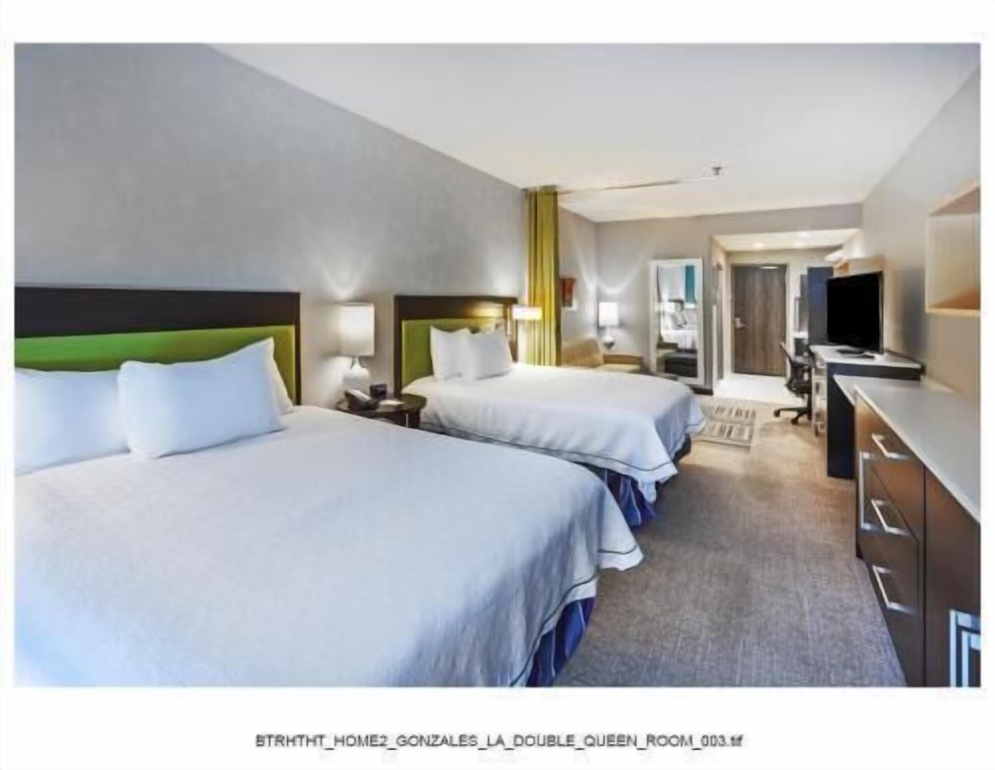Hypo-allergenic bedding, desk, laptop workspace, blackout curtains