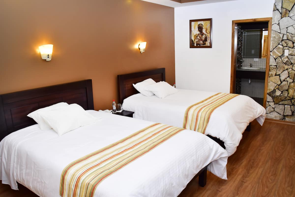 double room, 2 double beds | in-room safe, desk, iron/ironing board, free cots/infant beds