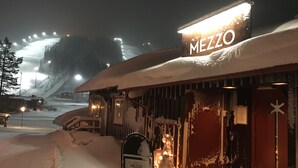 A snow-covered building with a sign reading "MEZZO HOTEL." - Hotel Mezzo (Lima)