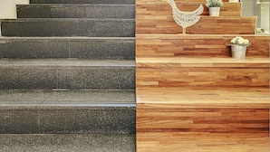 A staircase with a modern design, featuring a wooden finish on one side and a dark finish on the other. - Taiwan Youth Hostel & Capsule Hostel (Taipei)