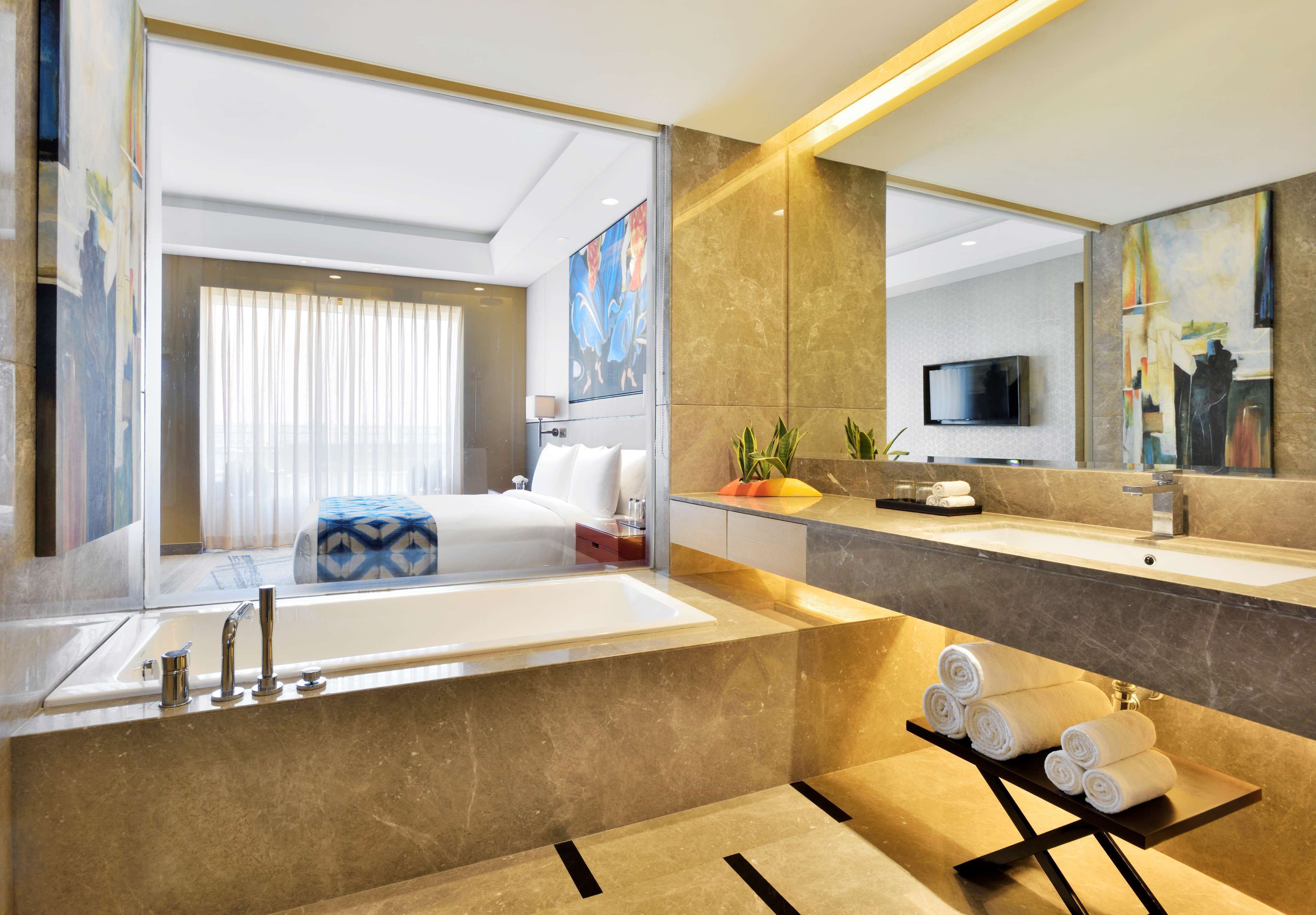 designer toiletries, hair dryer, bathrobes, slippers