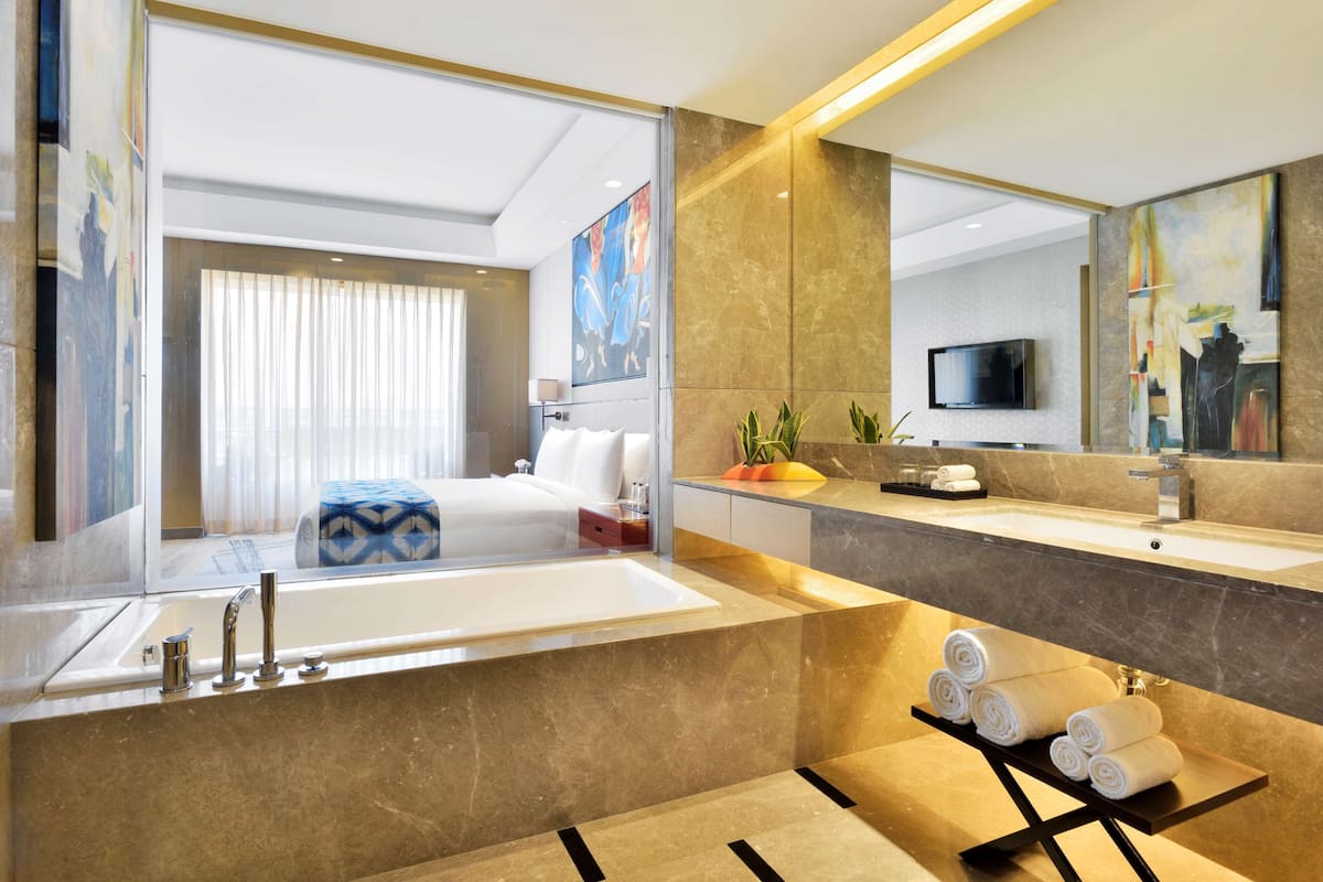 designer toiletries, hair dryer, bathrobes, slippers