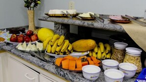 A buffet with various fruits, vegetables, and dairy products. - Alpha Ville Hotel (Assis)