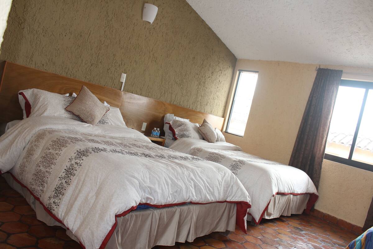 Family Room, 2 Queen Beds | In-room safe, desk, iron/ironing board, free WiFi